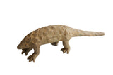 Vintage handmade African pangolin sculpture with a textured, scaled body and earthy patina.