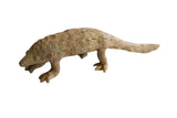 Vintage African pangolin sculpture with textured scales and a muted, earthy patina.