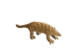Vintage handmade African pangolin sculpture with a textured, scaly body and an earthy brown finish.