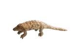 Vintage African pangolin sculpture with textured, hand-carved scales and an earthy patina.