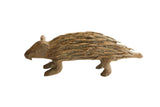 Vintage African porcupine sculpture with a rustic, textured body and stylized carved quills.