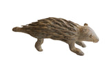 Vintage African porcupine sculpture with a rustic, textured body and earthy brown patina.
