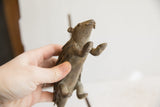 Angled view showing the underside and face of the handmade porcupine sculpture.