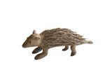 Vintage handmade African porcupine sculpture with a textured body and earthy brown patina.