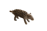 Vintage African porcupine sculpture with rustic textured quills and a dark matte finish.