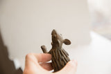 Textured head and detailed quills of the vintage African porcupine sculpture.