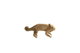 Vintage handmade African chameleon figurine with a rustic, earthy texture and coiled tail.