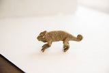 Vintage handmade African chameleon figurine with a rustic, textured surface.