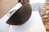 Antique African hand carved wooden bowl, dark wood with incised zigzag design and storied repair.