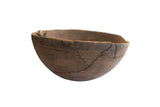 Antique African hand-carved wooden bowl featuring incised geometric designs and storied repairs.