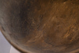 Textured interior of the antique African hand carved wooden bowl, showing cracks and rich brown patina.