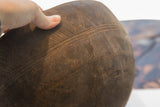 Incised lines and rich dark wood patina on the antique African carved bowl.