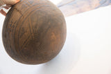 Close-up of an old repair and incised patterns along the rim of the wooden bowl.