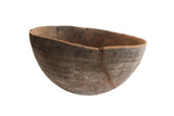 Large antique African hand carved wooden bowl with incised lines and old repairs.