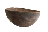 Antique African Hand Carved Wooden Bowl with dark, aged wood patina and rustic texture.