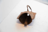 Rusted, handmade interior and clapper of the African Yoruba iron bell.