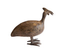 Vintage African cast bird collectible with a dark, weathered patina and prominent crest.