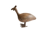 Vintage handmade African bird casting with a stylized form and aged metal patina.