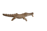 Vintage handmade African alligator sculpture with a fish in its mouth and detailed carved texture.