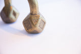Hand-stamped geometric patterns on the faceted, aged brass base of an antique African cuff.