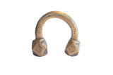 Antique African cuff bracelet with a U-shape, aged patina, and geometric engraved ends.