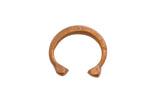Antique African copper snake cuff bracelet with etched geometric patterns and a warm patina.