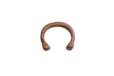 Handcrafted antique African copper cuff bracelet with a C-shape and stylized snake heads.