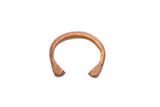 Antique African snake cuff bracelet with a textured, warm bronze patina.