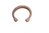 Antique African snake cuff bracelet with etched details and a warm patina.