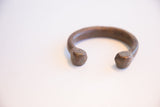 Antique African cuff bracelet showing the aged patina and smooth open ends.