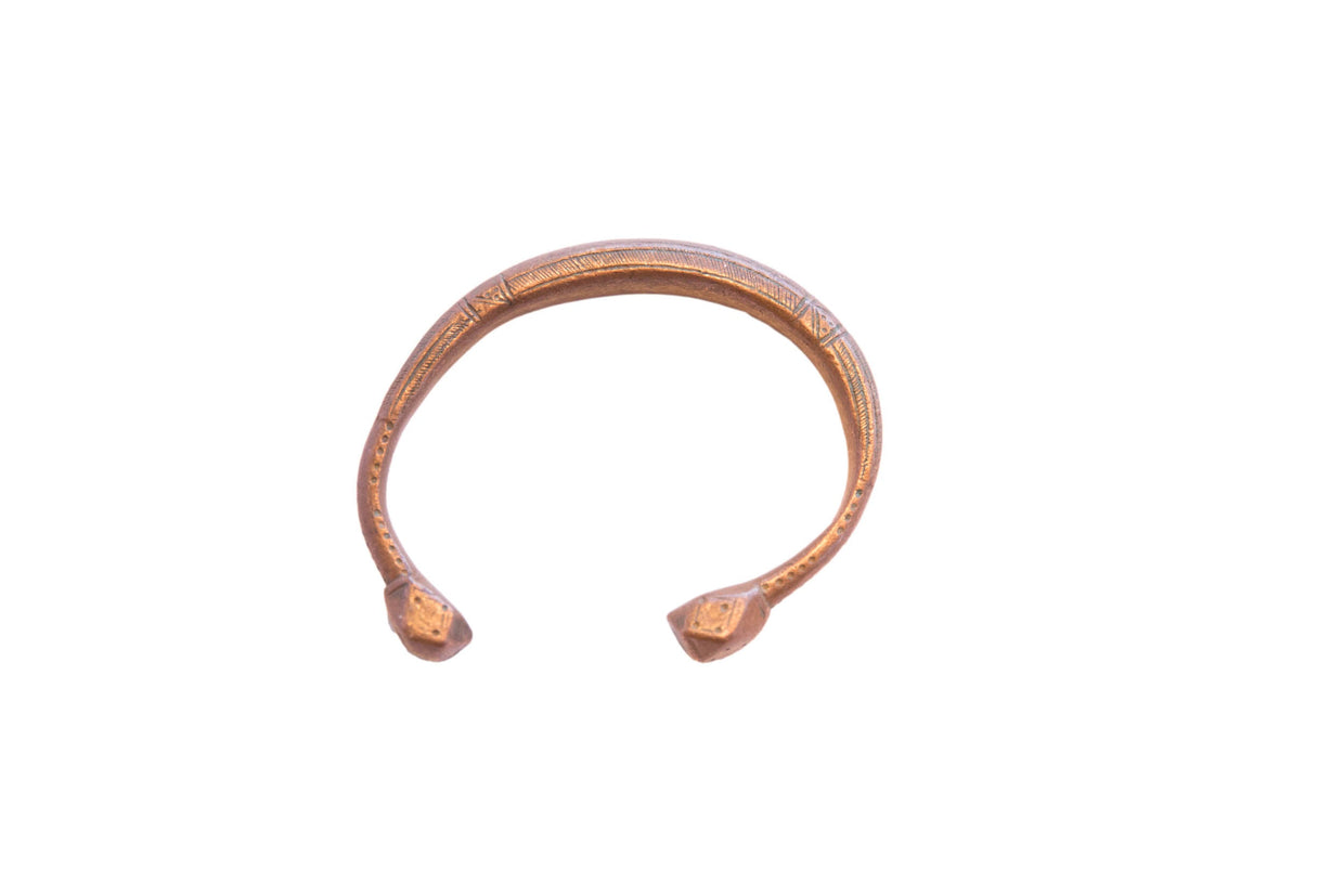 Antique African copper snake cuff bracelet with a rich patina and hand-etched details.