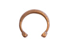 Antique African snake cuff bracelet with geometric engravings and a warm bronze patina.