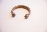 Antique snake cuff with a textured band and two detailed, faceted ends.