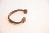 Antique African snake cuff bracelet showing its distinctive open form and patina.