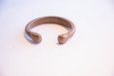 Smooth, rounded terminals on the open antique African copper cuff bracelet.