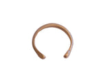 Antique African snake cuff bracelet with a simple, handmade form and a warm metal patina.