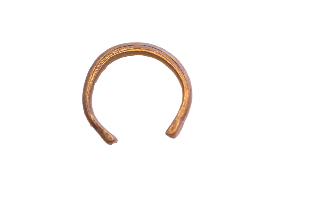 Antique African snake cuff bracelet with an oxidized brass patina and etched textural details.