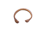 Antique African snake cuff bracelet with a textured surface and aged bronze patina.