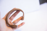 Side view of the collectible African snake cuff, highlighting its unique form and patina.
