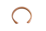 Antique African snake cuff bracelet with a simple open form and a warm, aged metal patina.