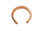 Antique African snake cuff bracelet with a warm, oxidized patina and simple handmade form.