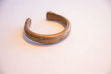 Profile of the antique snake cuff bracelet highlighting its open shape and aged patina.