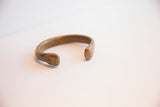 View of the antique snake cuff's opening and aged metal finish.