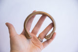 Full circular shape and aged patina of the antique snake cuff bracelet.