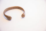 View of the antique African cuff's opening and hand-forged terminals.