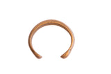Antique African snake cuff bracelet with a warm, oxidized metal patina and open design.