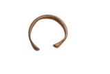 Antique African snake cuff bracelet with a simple, rounded C-shape and an aged bronze patina.