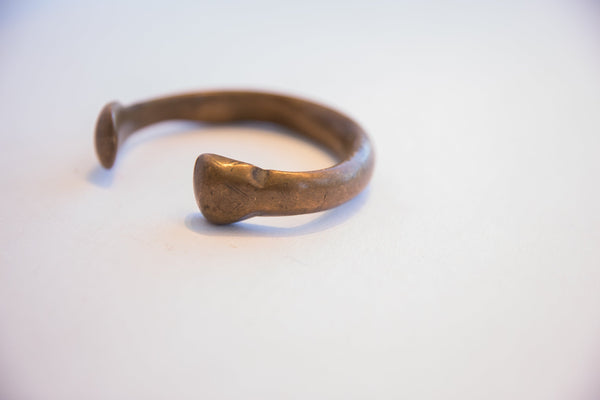Side profile of the antique snake cuff showing the hand-formed terminal.
