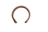 Antique African snake cuff bracelet with a textured surface and time-softened patina.