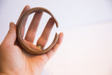 The curved profile and inner dimension of the handmade African cuff bracelet.